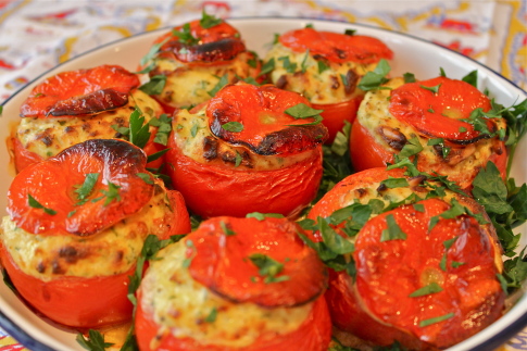 Baked tomatoes filled with goats cheese and herbs