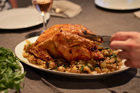 Roast chicken with fennel, potato and black olive stuffing