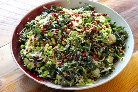 Shredded Kale and Brussel Sprout salad with almonds, Pecorina cheese and pomegranate seeds