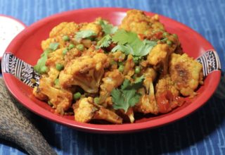 Poonams roasted cauliflower with peas and tomatoes