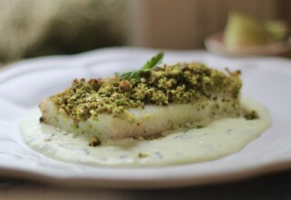 baked fish with nutty crust and coconut sauce